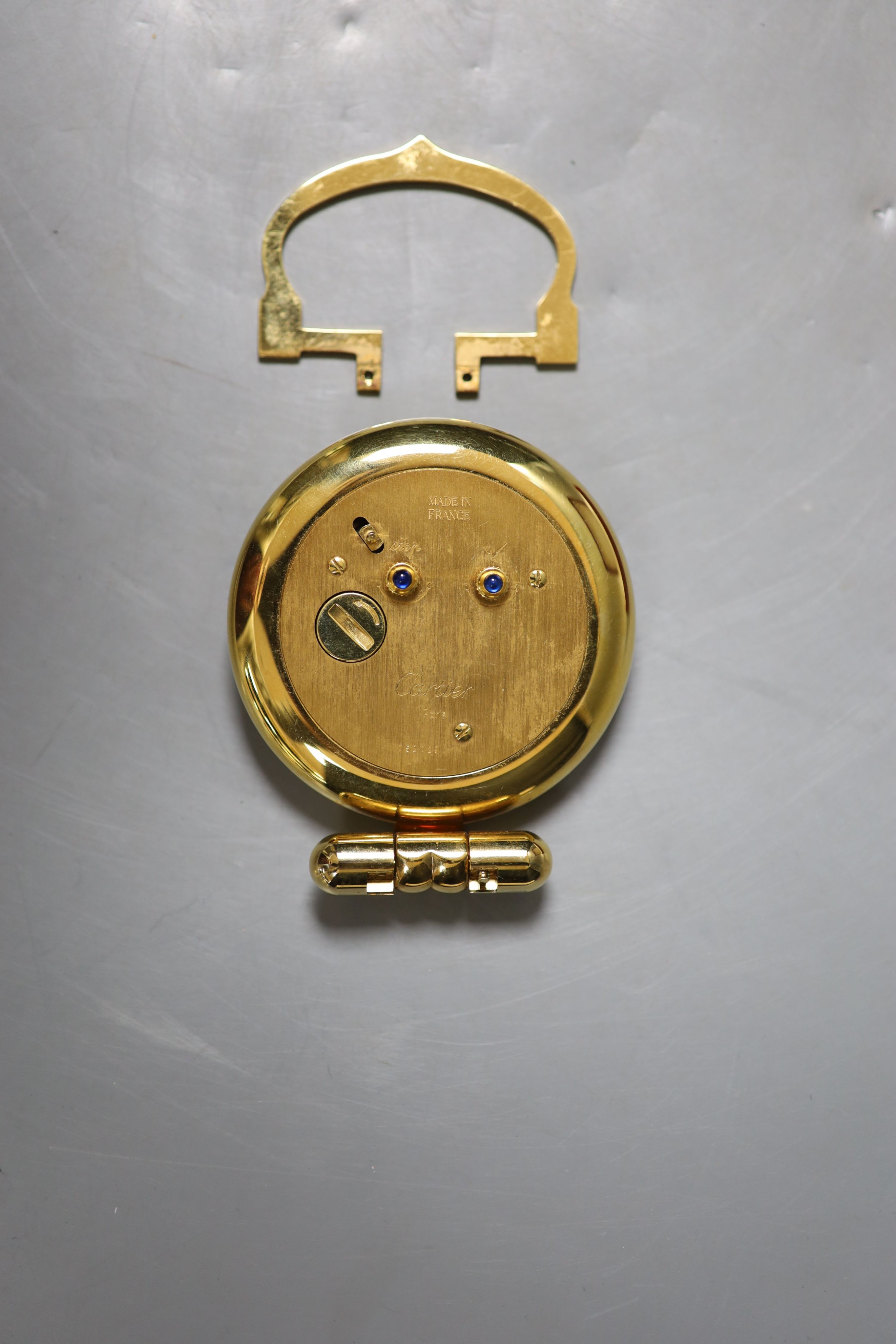 A cased Cartier gilt metal travelling timepiece